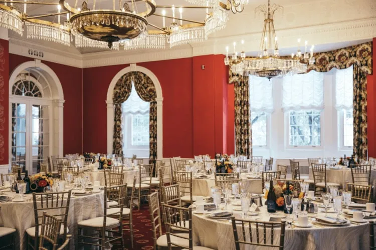 The grand dining room at Judson Manor with crystal chandeliers and elegant furnishings
